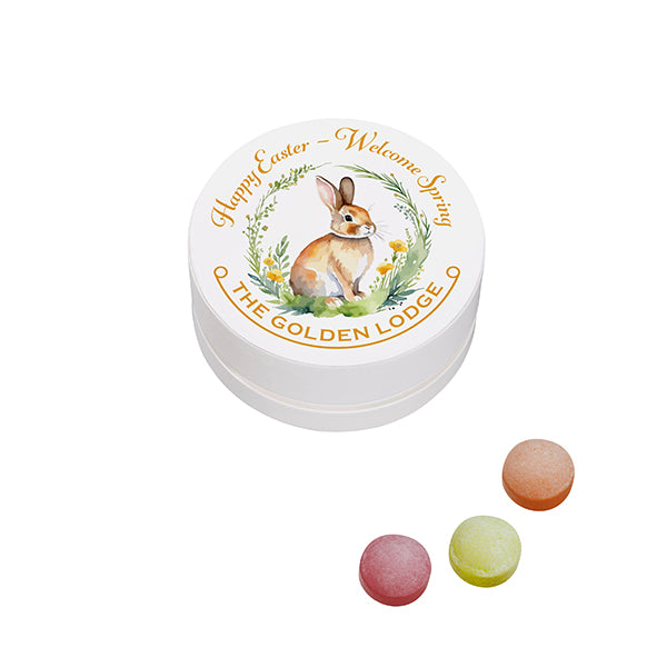 Runde weiße Papierdose mit Fruchtbonbons und bedrucktem Logodeckel