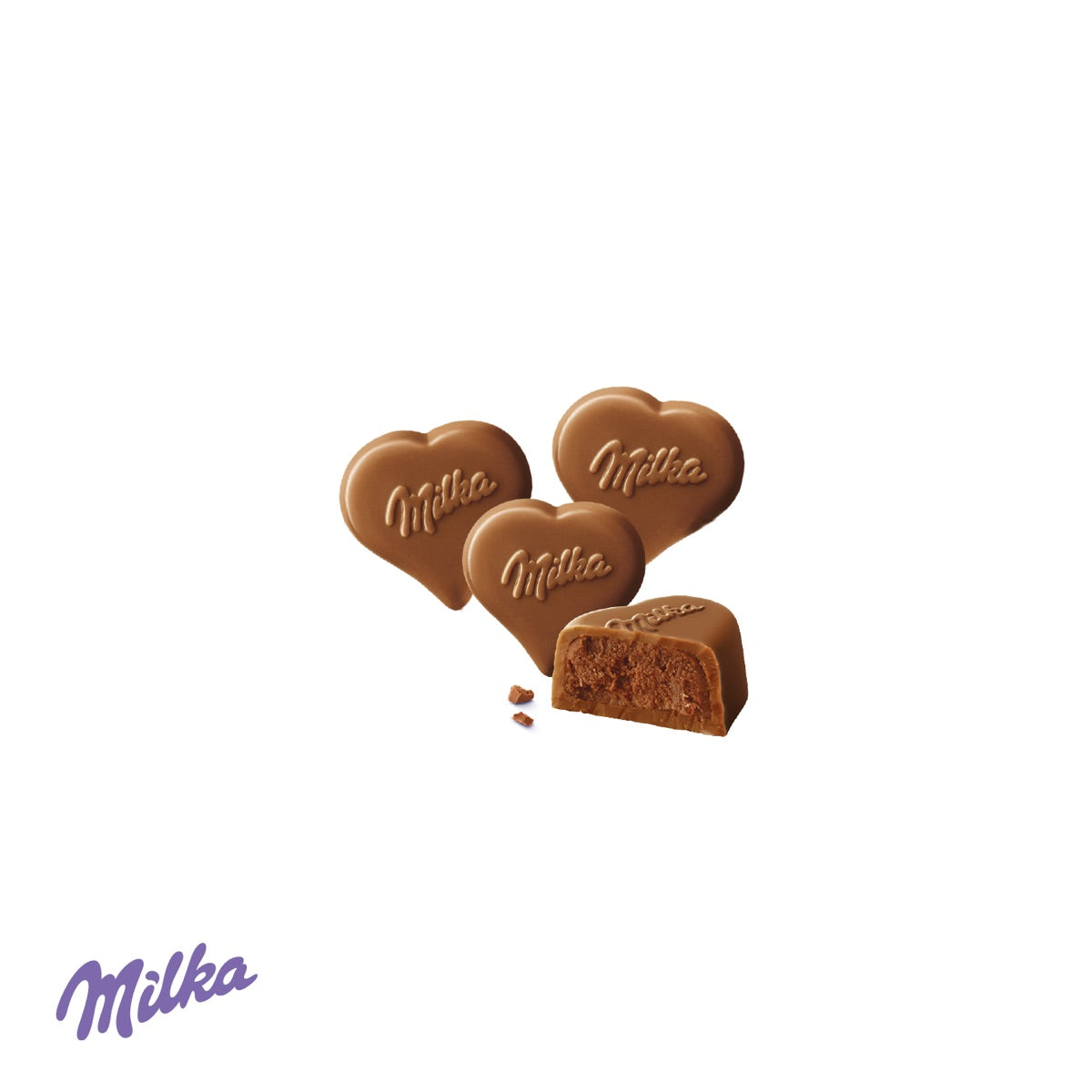 Geöffnete Kartonage mit I LOVE MILKA Herz und Pralinés
