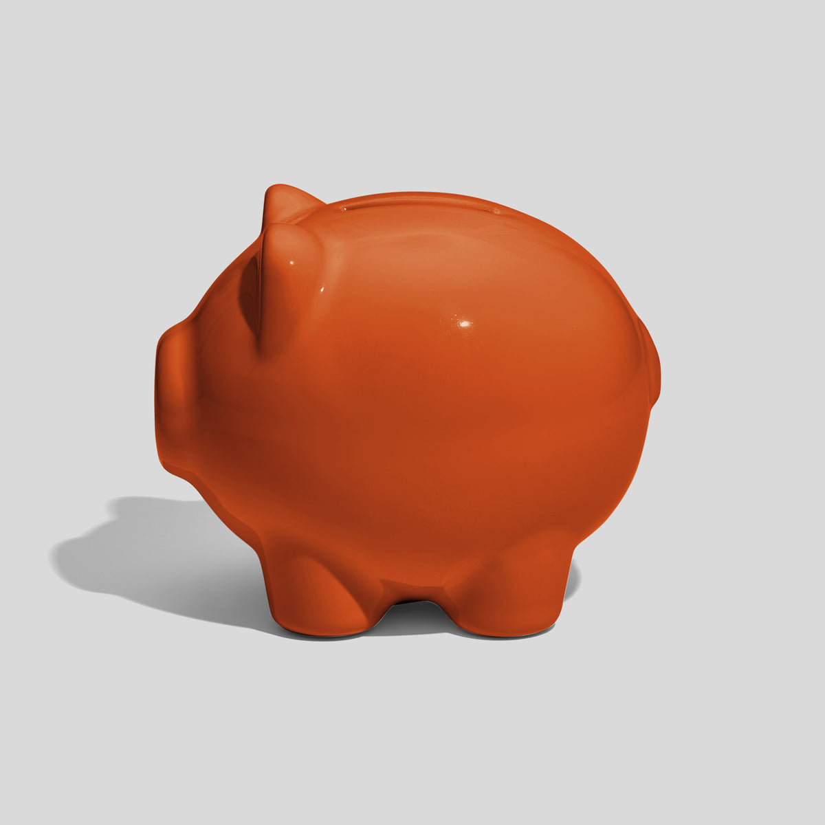 Kleine Spardose in Schweinform 9,5 cm lang – Orange