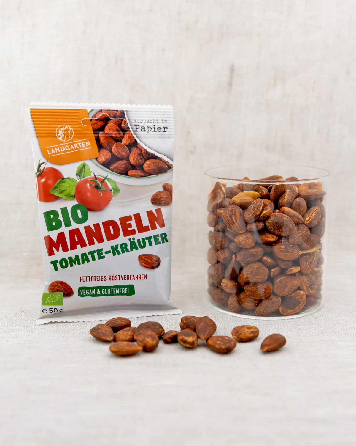 LANDGARTEN Bio Mandeln Tomate Kräuter 50 g mit Logo Button