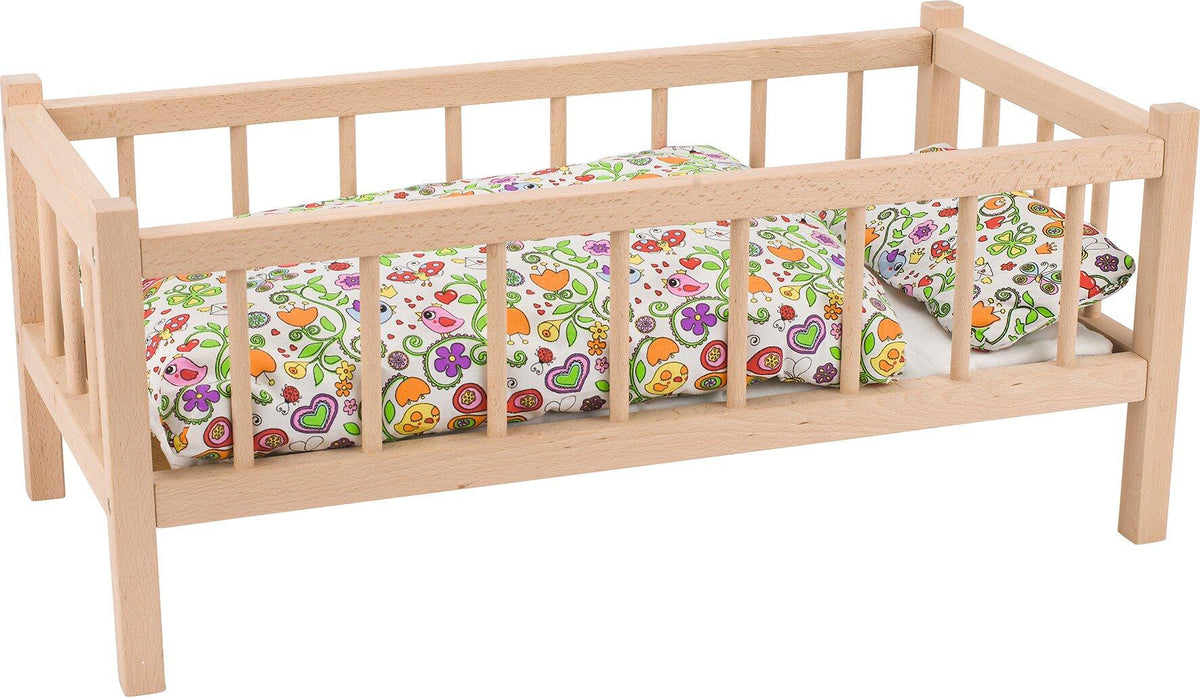 Puppenbett aus hellem Holz mit Stäben, 60 cm lang