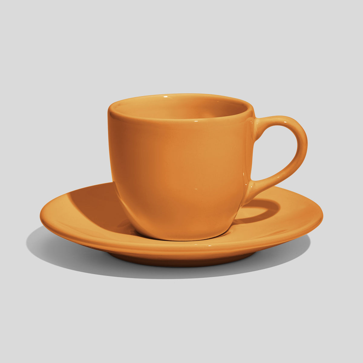 Rundliche Tasse mit Untertasse 180 ml und Bogenhenkel – Senfgelb